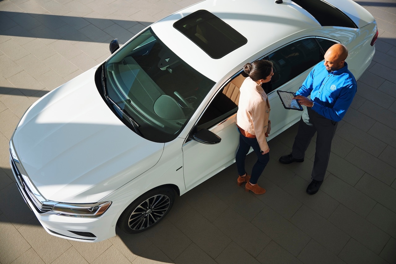 Volkswagen Technician working on a vehicle