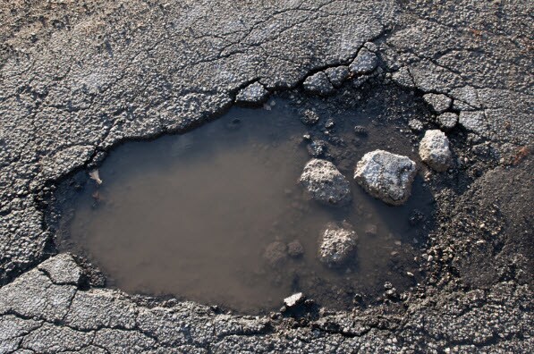 Pothole filled with water