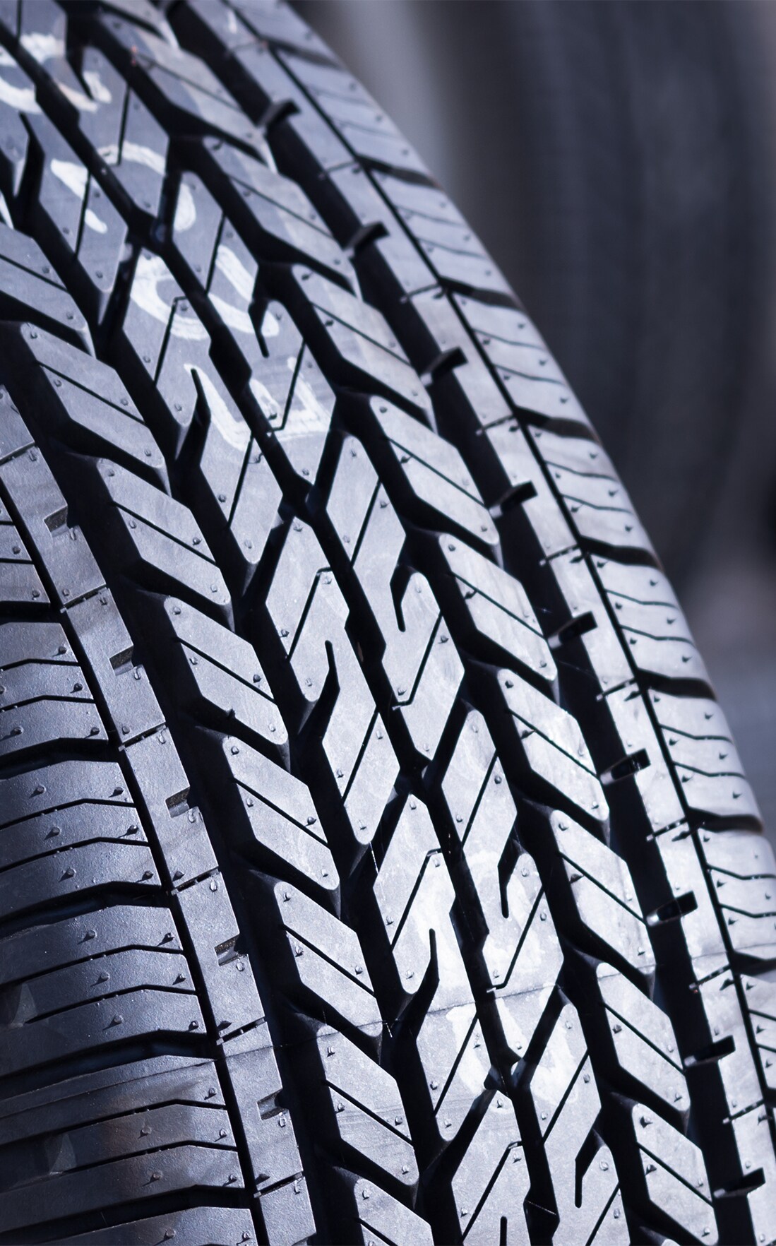Winter Tires vs. All Season Tires at Haddad Toyota in Pittsfield, MA  | Close up of a new car tire 