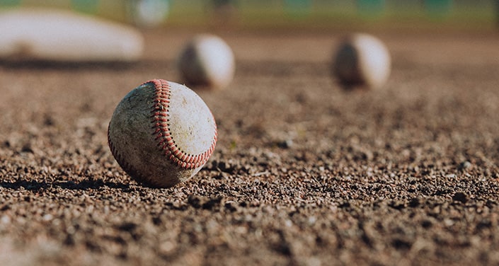 Haddad Toyota is a Toyota Dealership near Pittsfield, MA | Baseballs Sitting on Groubnd in Baseball Field