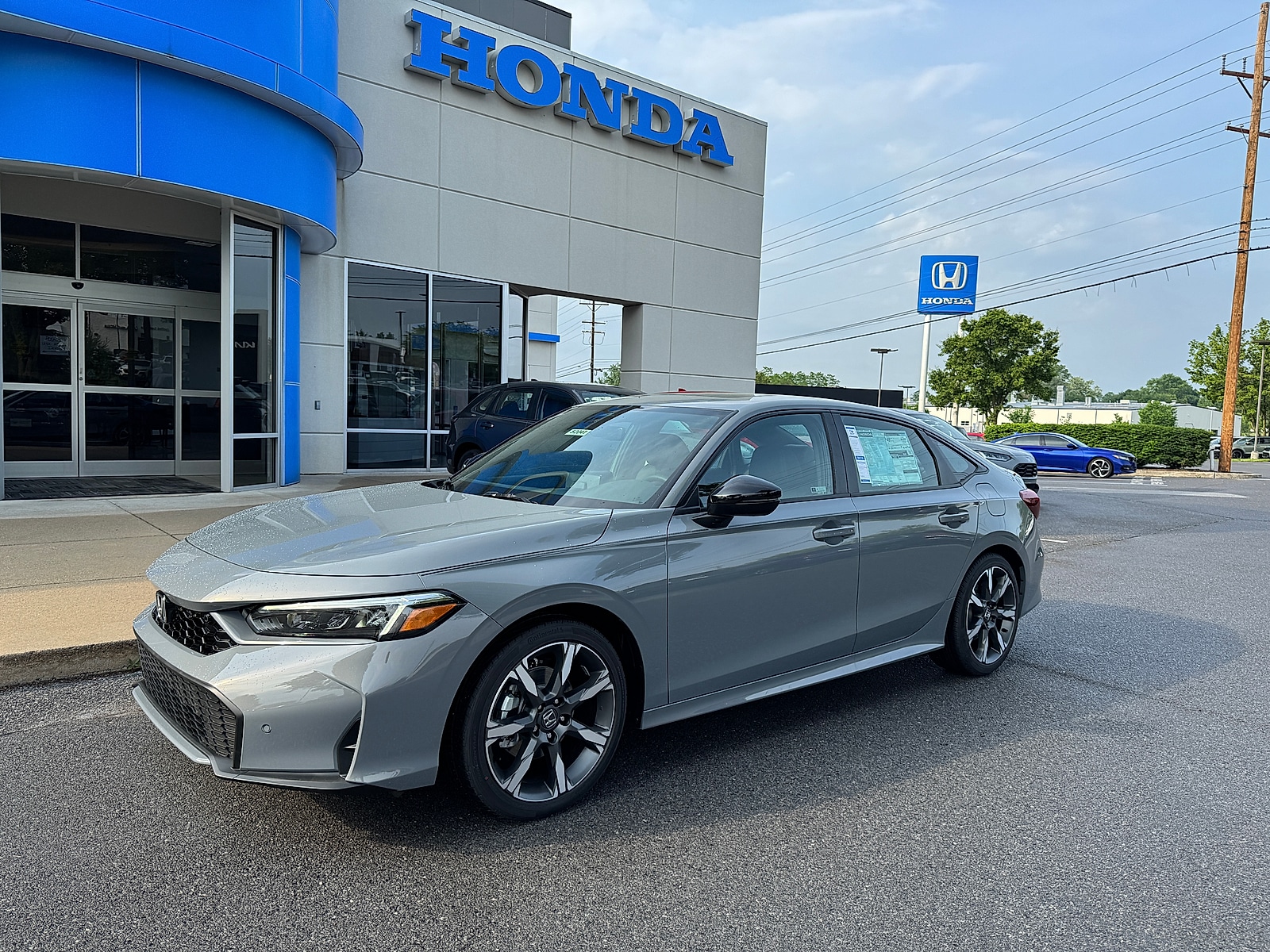2026 Honda Civic Sport Touring Hybrid CVT's photo