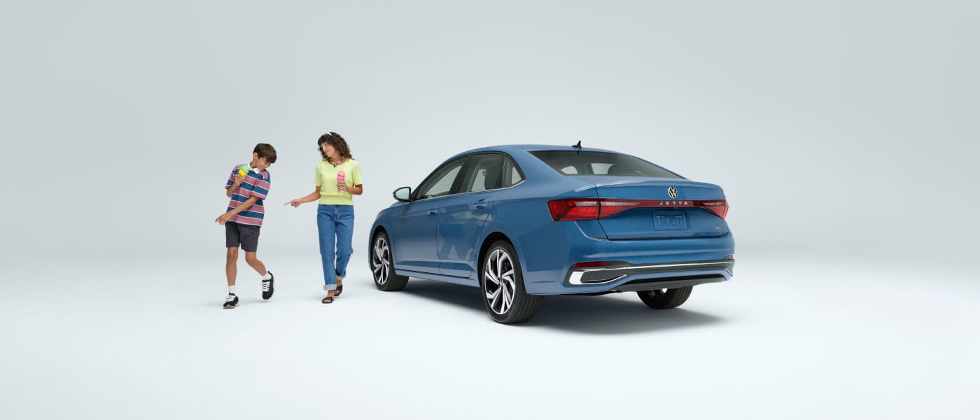 2025 VW Jetta side view with two people from back