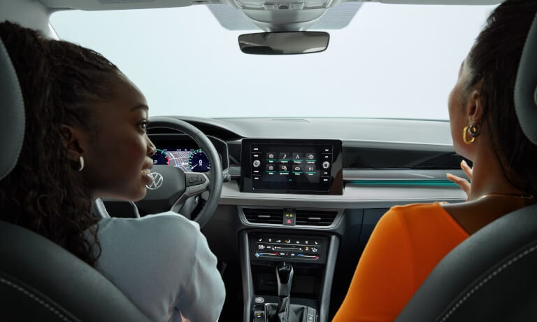 2025 Volkswagen Taos interior front with passengers