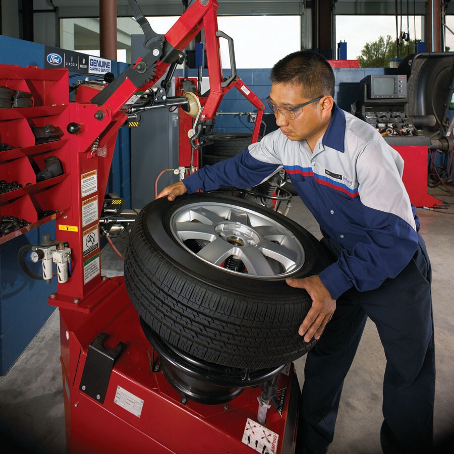 Ford mechanic new tire