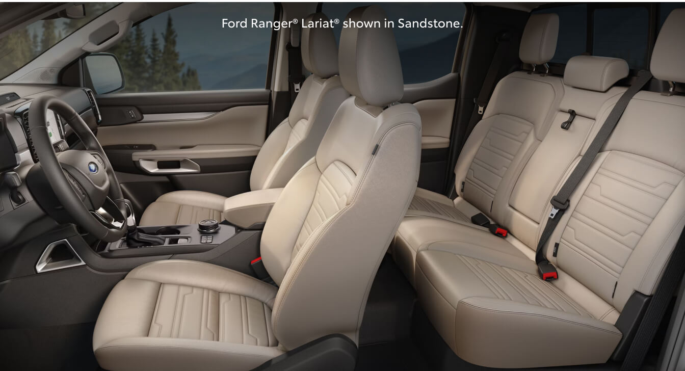 Studio interior view of a 26 Ford Ranger Lariat showcasing its premium Sandstone leather seats.