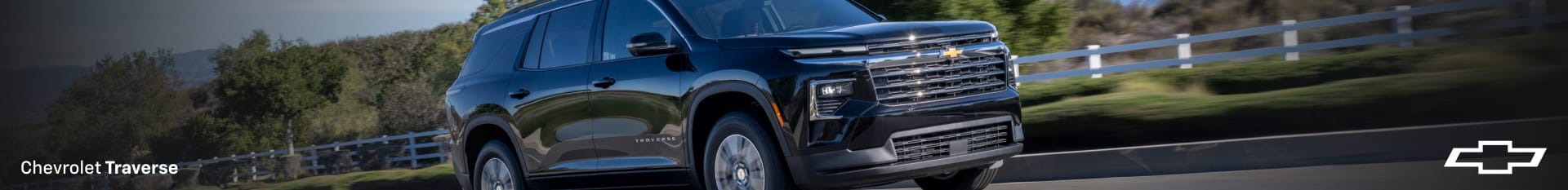 Chevy Traverse driving down a countryside road