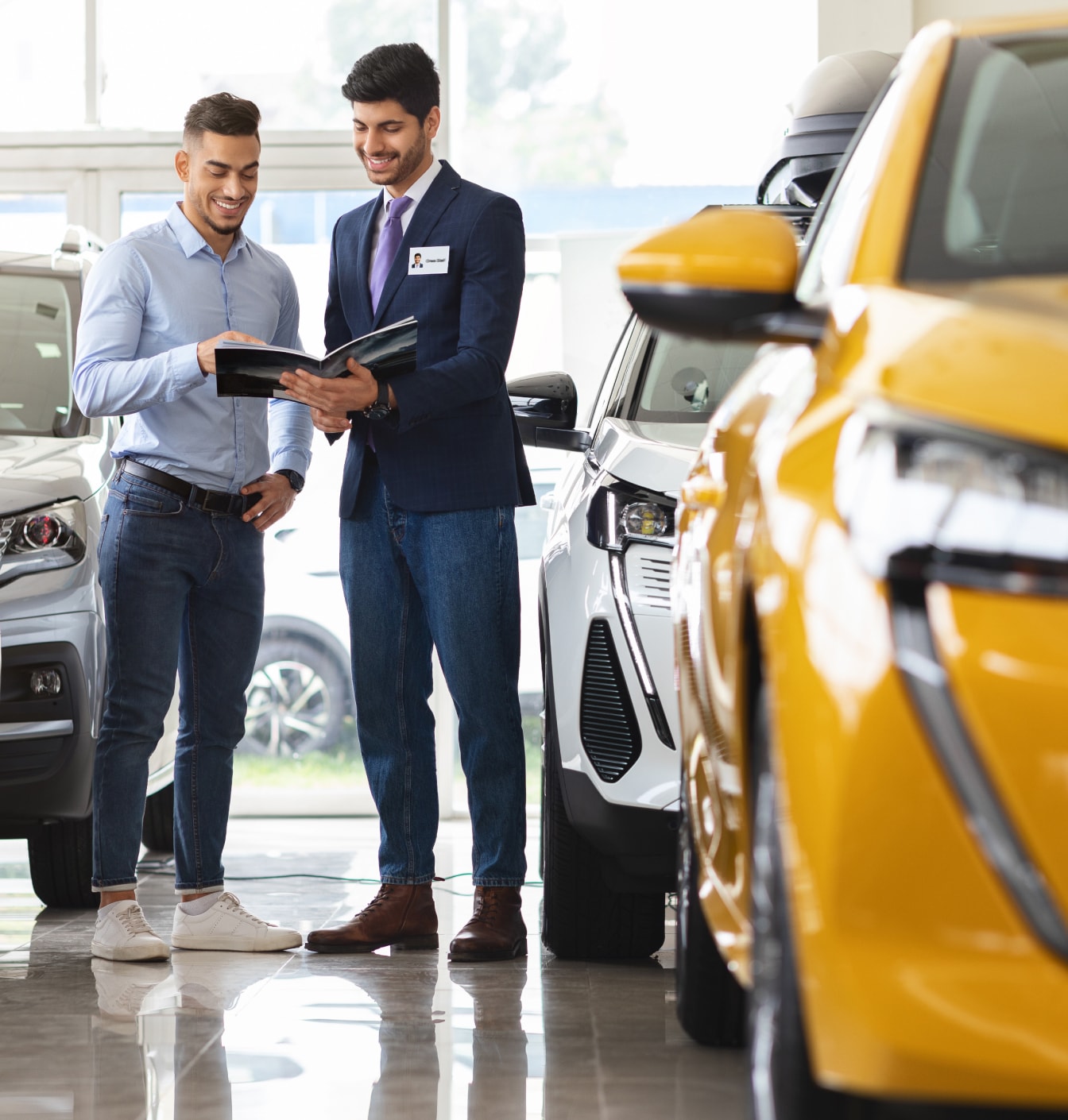 Car salesman helping customer