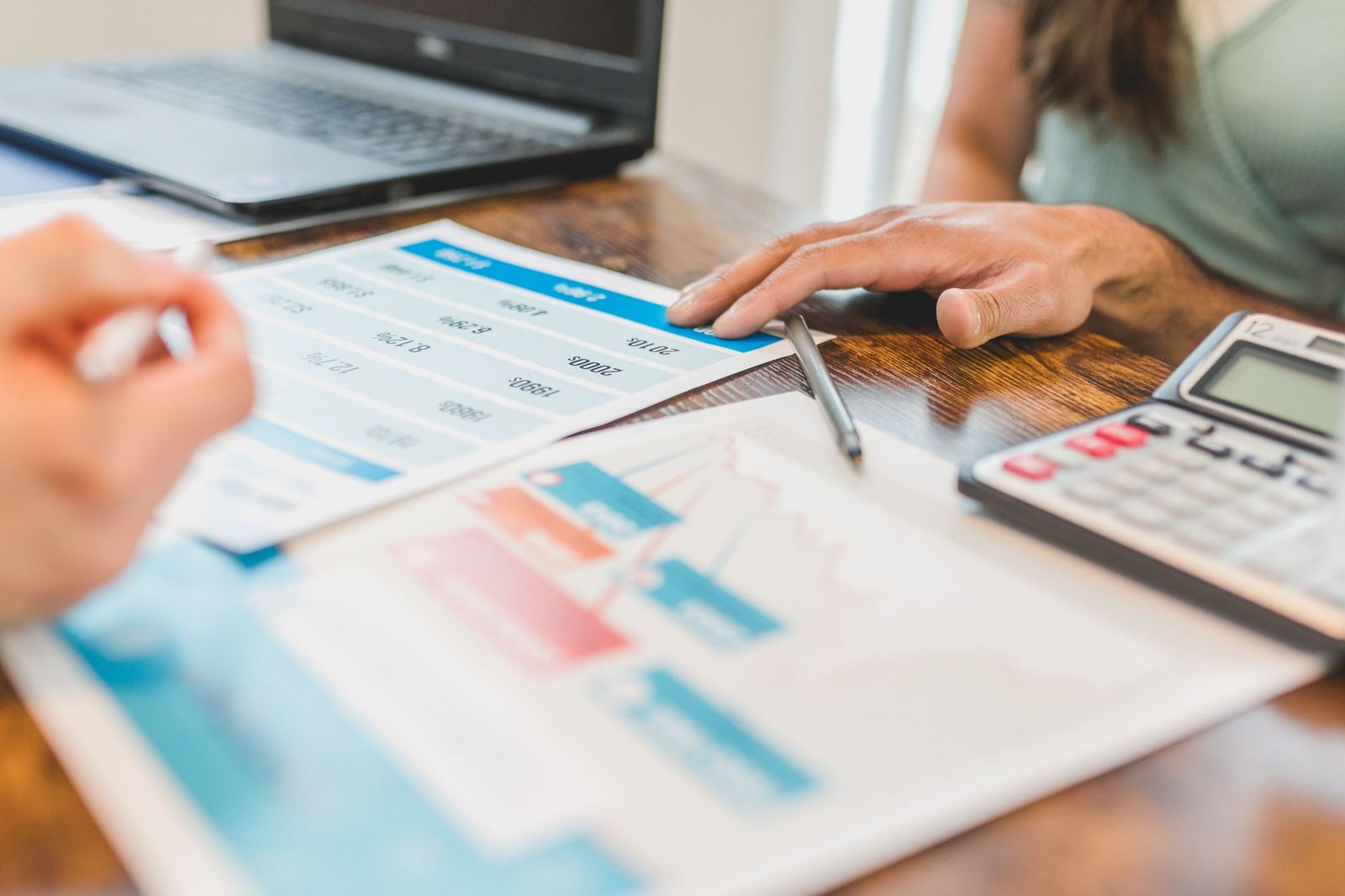 Comparing printed loan rates with a calculator before financing a car