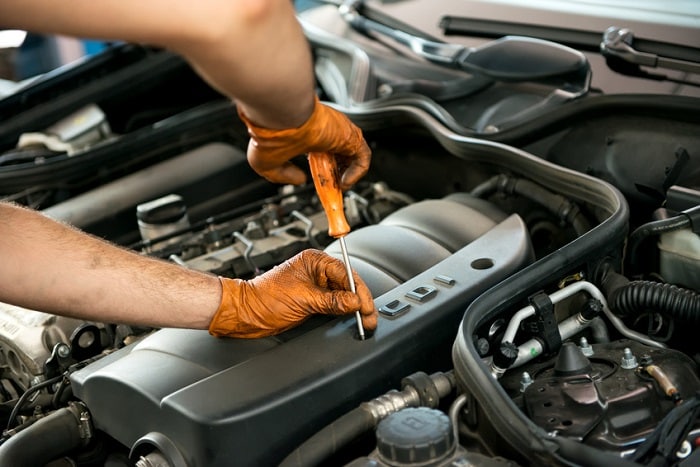 Man_Working_On_Car_Engine.jpg