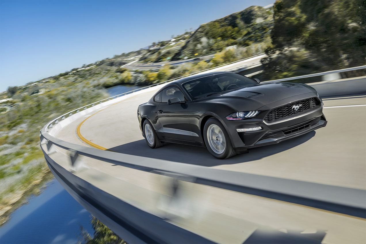 Ford Mustang driving on a curvy road.jpg