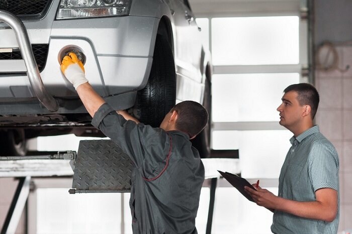 Mechanic inspecting a car.jpg