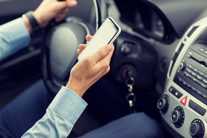 Driver_Looking_At_Phone_While_Driving.jpg