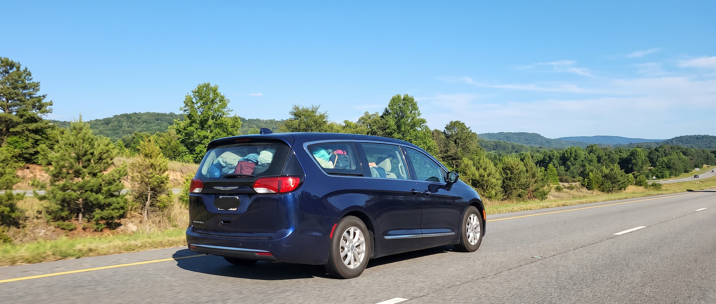 Chrysler Pacifica minivan and Dodge Durango SUV side by side for Birmingham summer family road trips