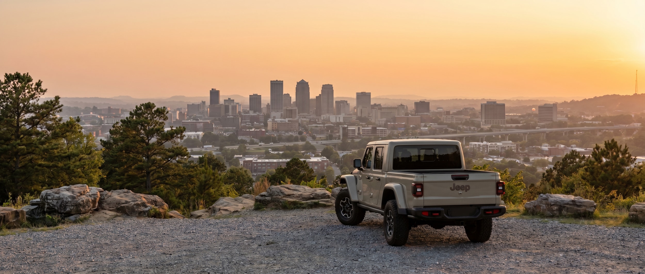 Jeep Gladiator truck overlooking Birmingham AL from Red Mountain scenic viewpoint