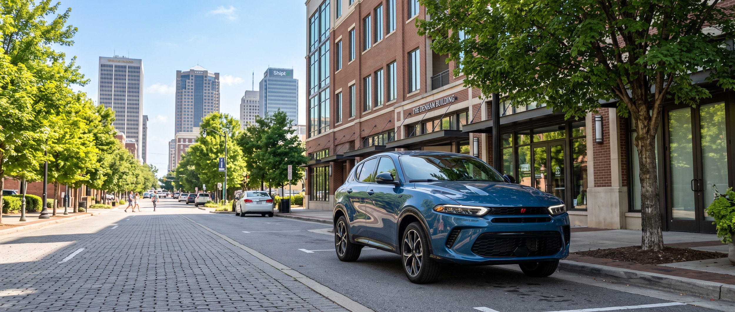 2025 Dodge Hornet GT parked on a Birmingham Alabama urban street near UAB campus on a summer morning