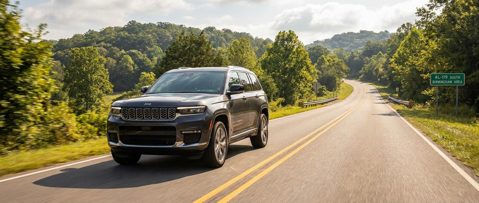 2026 Jeep Grand Cherokee on a hilly two-lane road east of Birmingham, Alabama