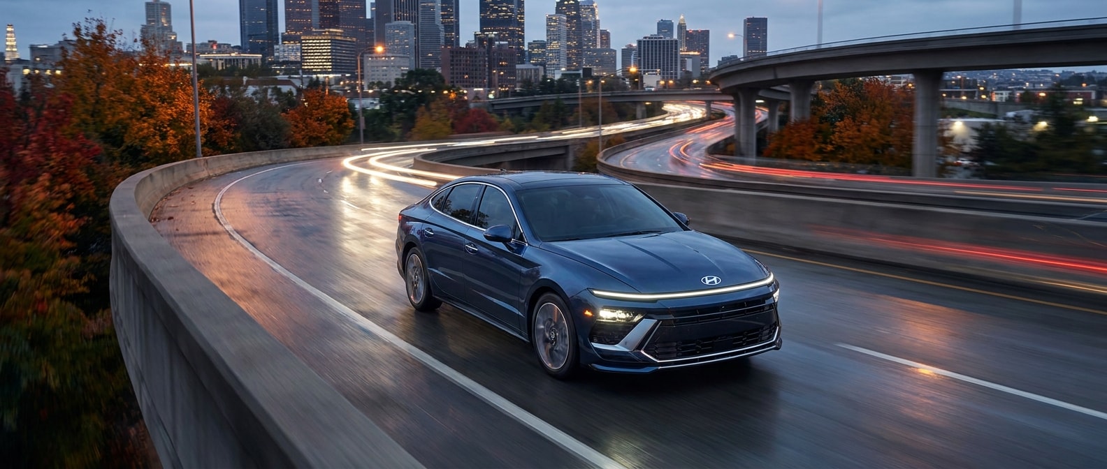 2026 Hyundai Sonata on I-65 Birmingham highway at dusk during fall commute
