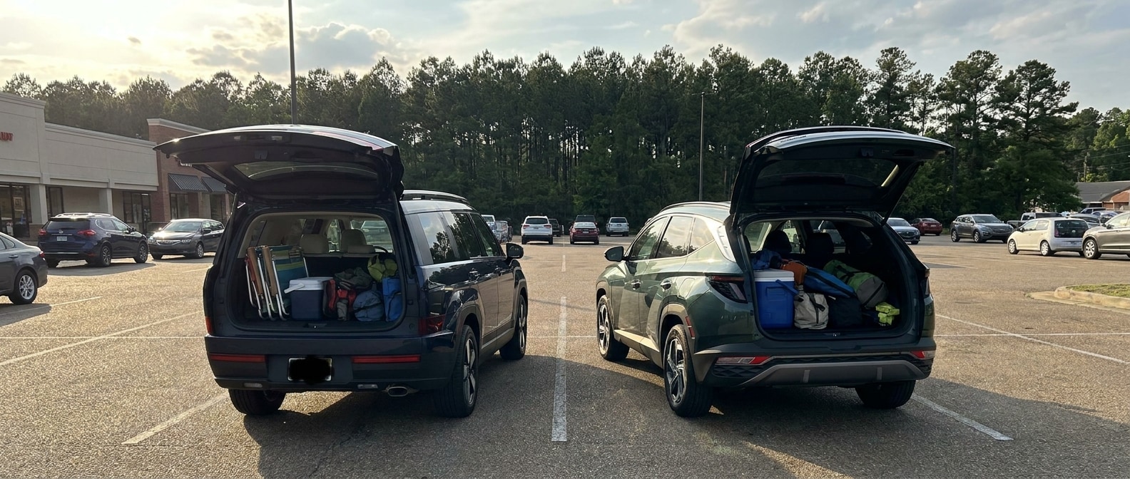 2026 Hyundai Tucson and 2026 Hyundai Santa Fe parked side by side in Flowood Mississippi with liftgates open