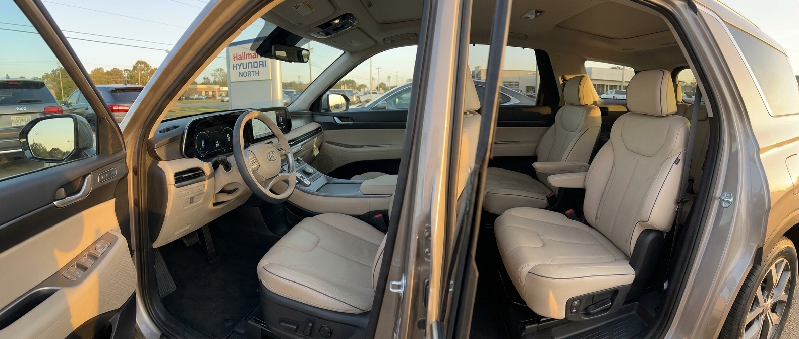 2026 Hyundai Palisade interior with front driver seat and second-row captain's chairs at Hallmark Hyundai North in Ridgeland, MS