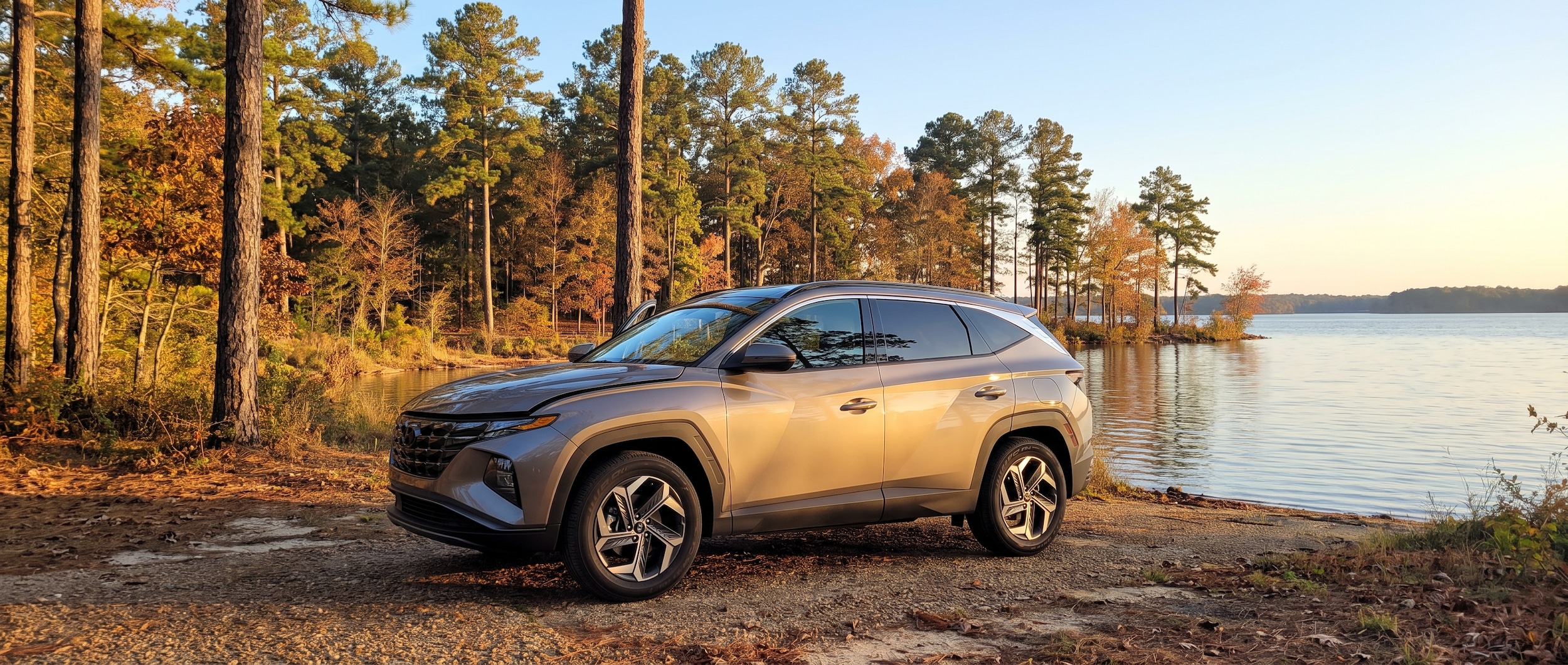 2026 Hyundai Tucson parked near the Ross Barnett Reservoir in Ridgeland MS on an October morning with pine trees in the background