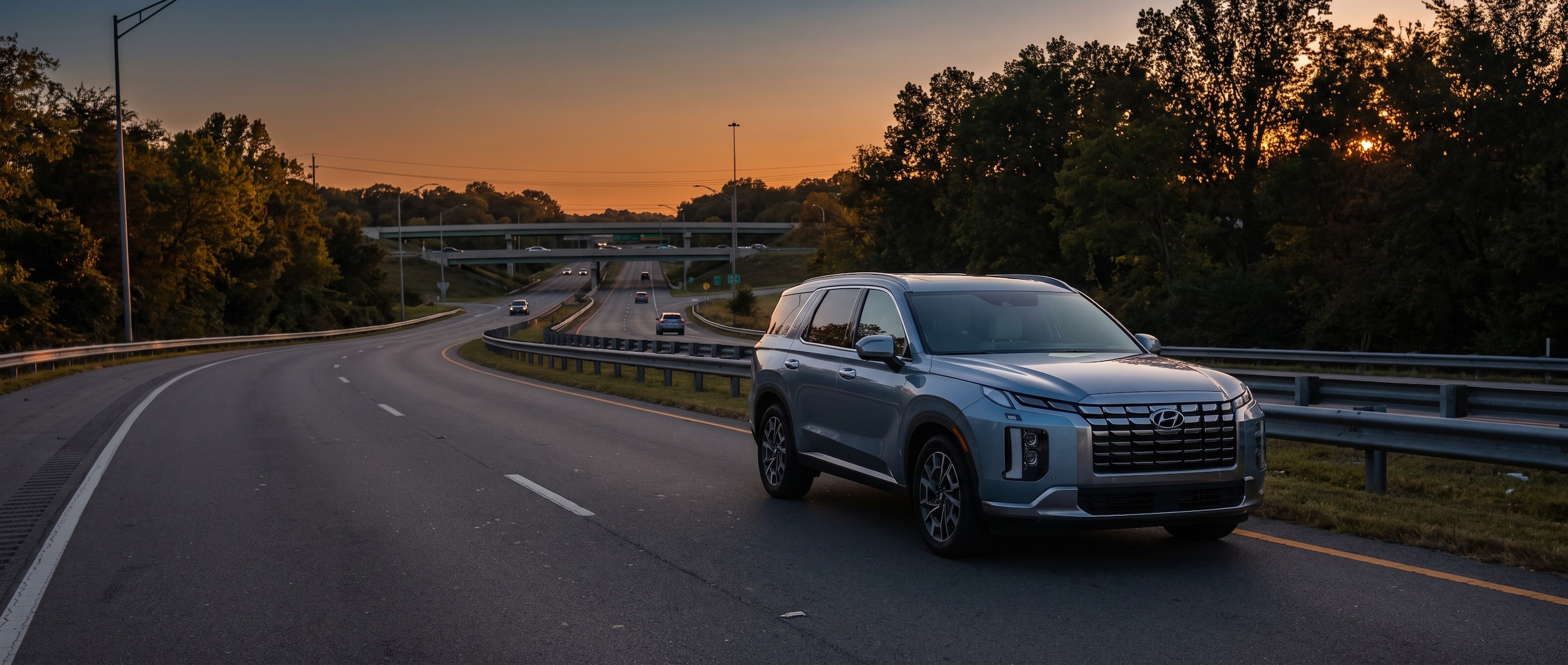 A 2026 Hyundai Palisade in a silver or blue exterior parked on a Tennessee highway on-ramp at dusk, with a freeway interchange visible in the background, conveying a suburban Nashville commuter context with soft summer lighting