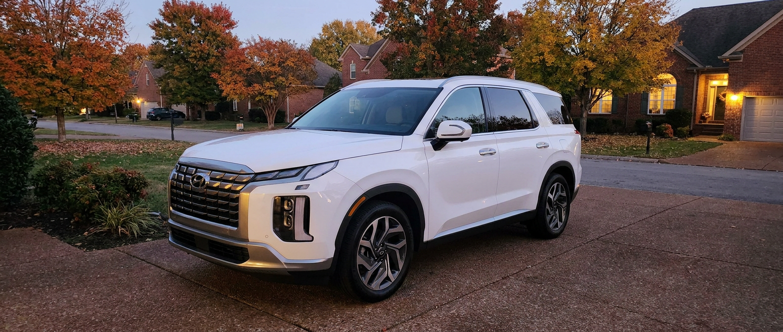 2026 Hyundai Palisade three-row family SUV in a Hendersonville TN suburban neighborhood surrounded by autumn foliage