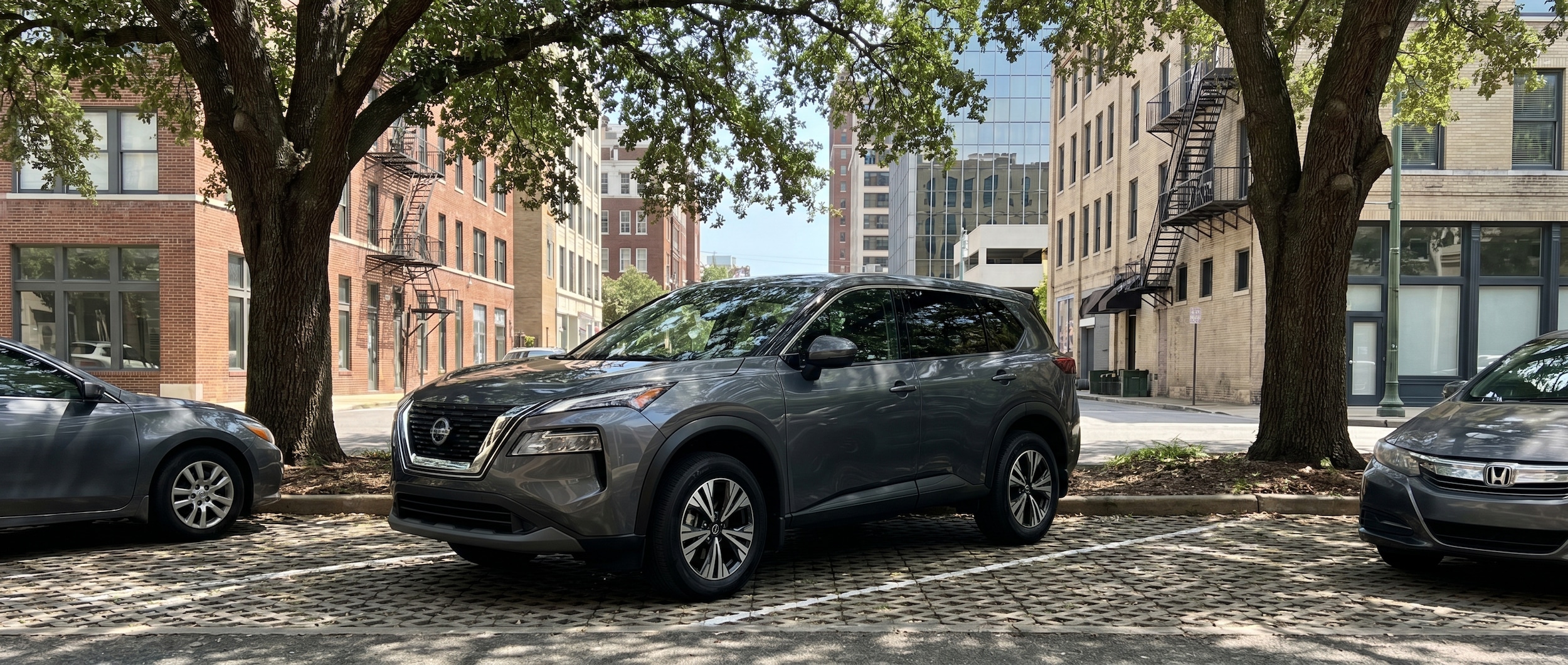 Nissan vehicle with cabin cooling features parked in shade downtown Birmingham AL