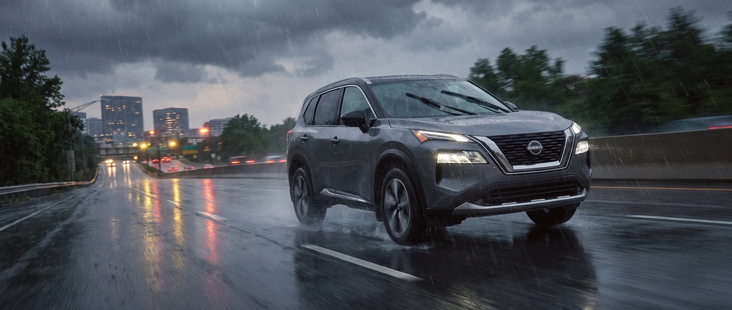 2026 Nissan Rogue driving on wet Birmingham highway during summer thunderstorm