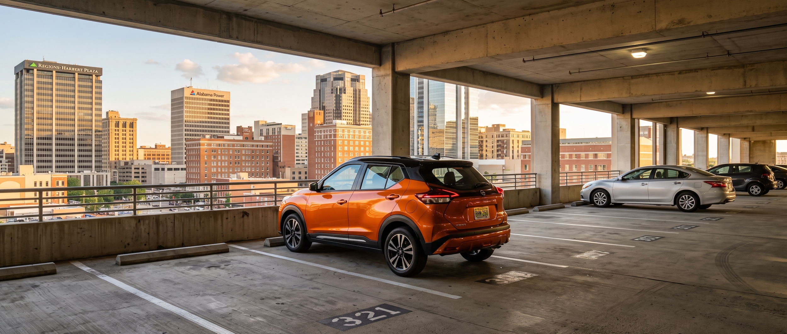2026 Nissan Kicks parked in a downtown Birmingham parking garage on a summer evening