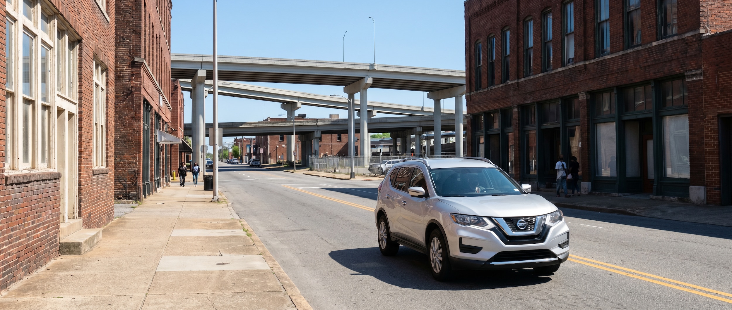 Nissan Rogue driving through Birmingham AL city streets versus highway showing real-world MPG comparison
