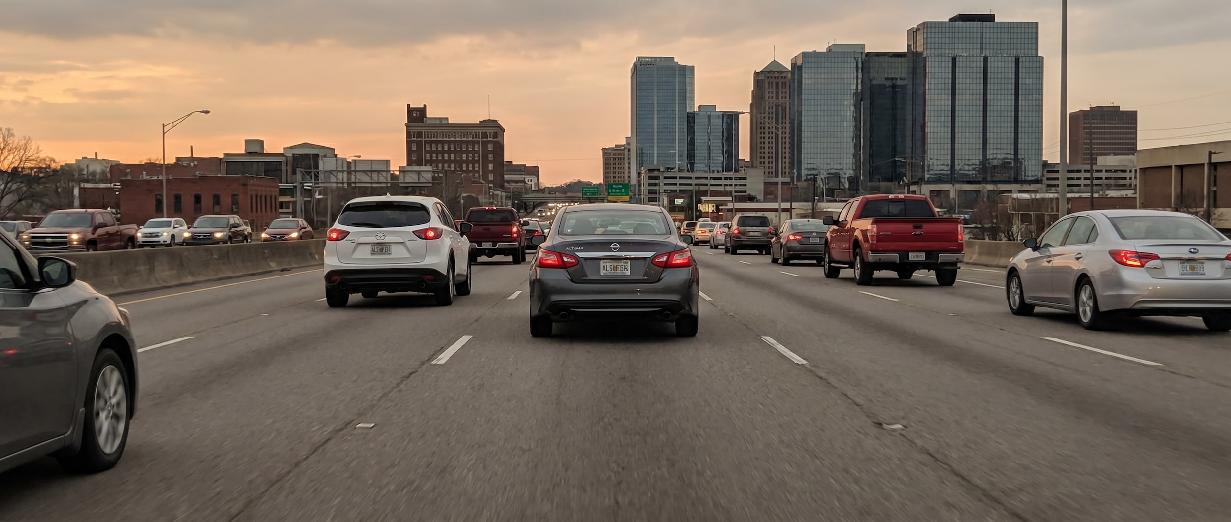 Nissan vehicles demonstrating defensive driving techniques in Birmingham, AL traffic