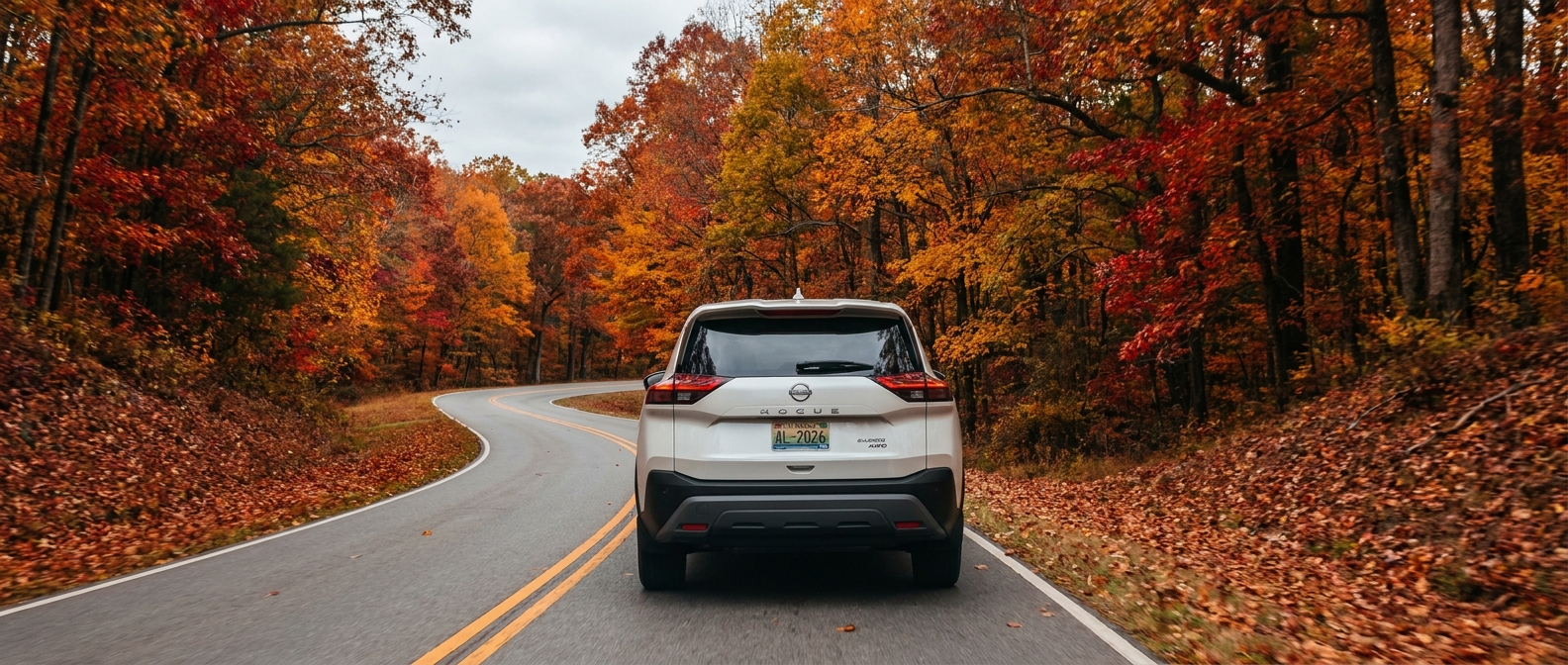2026 Nissan Rogue AWD on a winding Appalachian foothills road in northeast Alabama during fall foliage