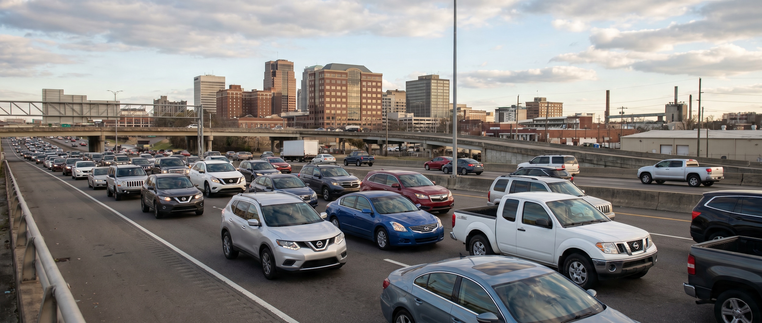 Nissan vehicles navigating I-65 traffic through Birmingham, AL