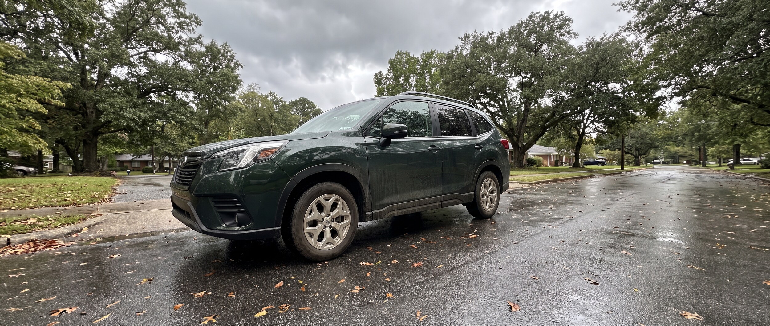 Used 2022 Subaru Forester on a wet Birmingham Alabama suburban road after summer rain