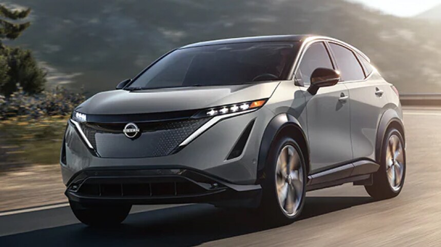 Gray Nissan SUV driving on the highway