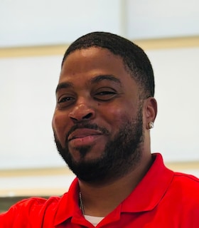 Staff member Jordan Arceneaux from 34588edd7637
