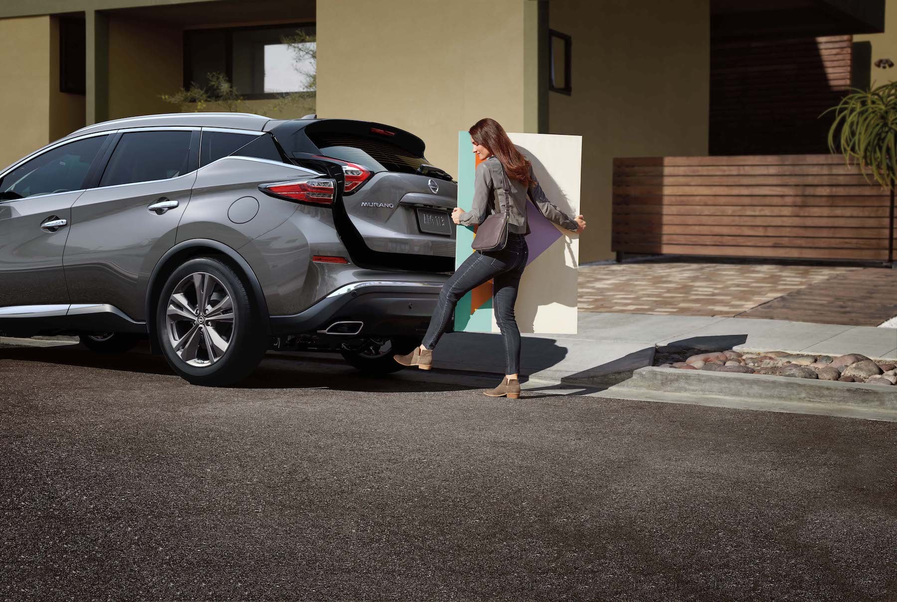 Features of the 2019 Nissan Murano at Hanover Nissan | Woman opening the trunk of the 2019 murano hands free