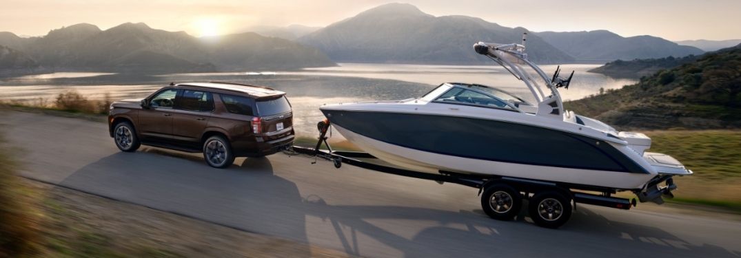 Brown 2022 Chevy Tahoe Towing a Boat