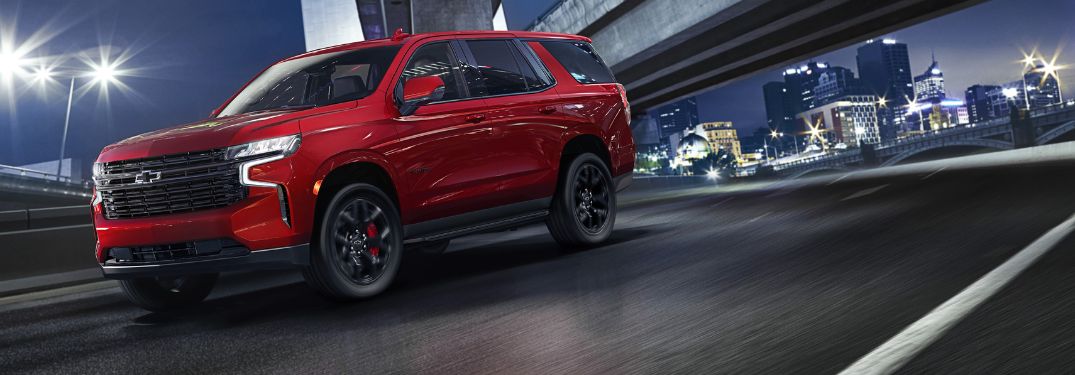 Red 2023 Chevy Tahoe RST Performance Edition Front Exterior on Freeway at Night