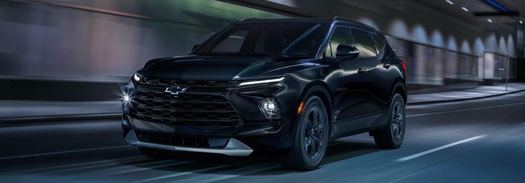 Black 2023 Chevy Blazer on a City Street at Night