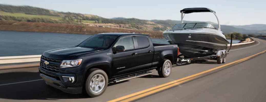 2022 Chevy Colorado black towing a boat side view