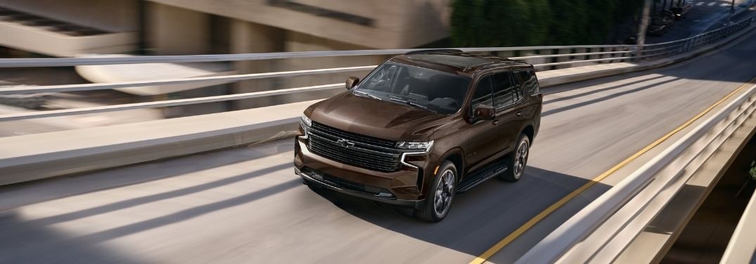 Brown 2022 Chevy Tahoe on a Freeway