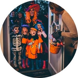 Mom Handing Out Candy at Halloween