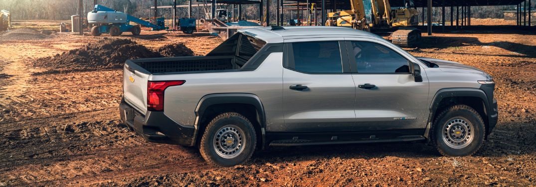 Gray 2024 Chevy Silverado EV Side Exterior on a Jobsite
