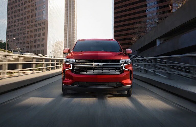 2022 Chevy Tahoe red front view on the road in motion