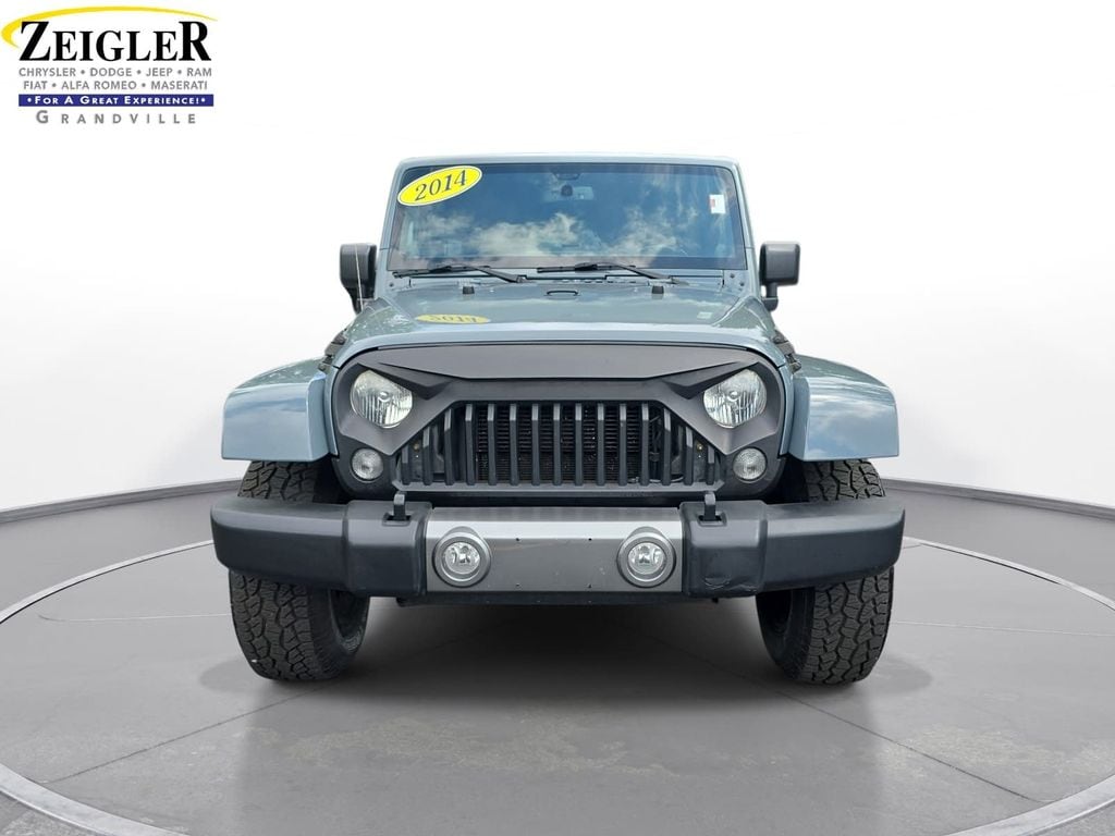 Used 2014 Jeep Wrangler Unlimited Sahara with VIN 1C4BJWEG7EL132967 for sale in Grandville, MI