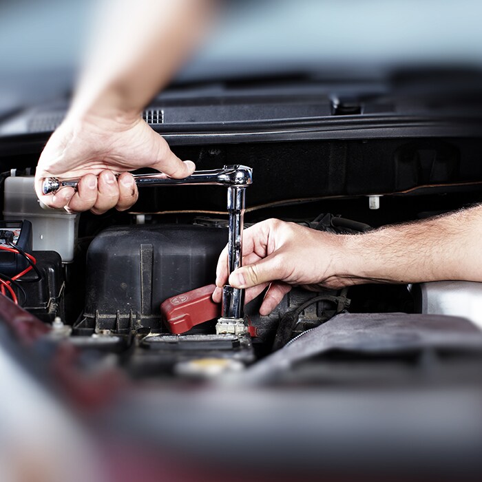  Toyota mechanic repairing a vehicle