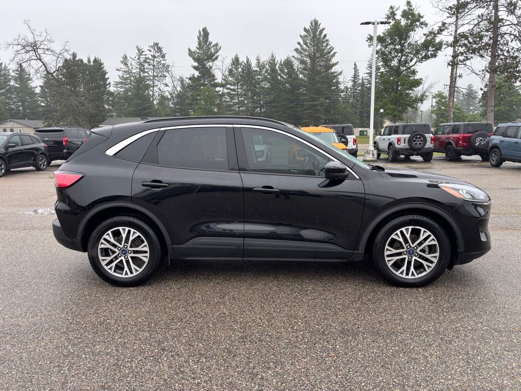 Used 2021 Ford Escape SEL with VIN 1FMCU0CZ4MUB13553 for sale in Roscommon, MI