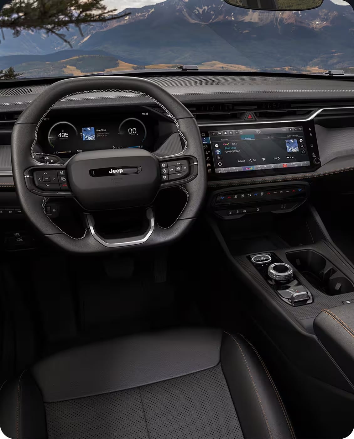 Interior view showing the large Uconnect 5 touchscreen and digital gauge cluster of the 2026 Grand Cherokee.