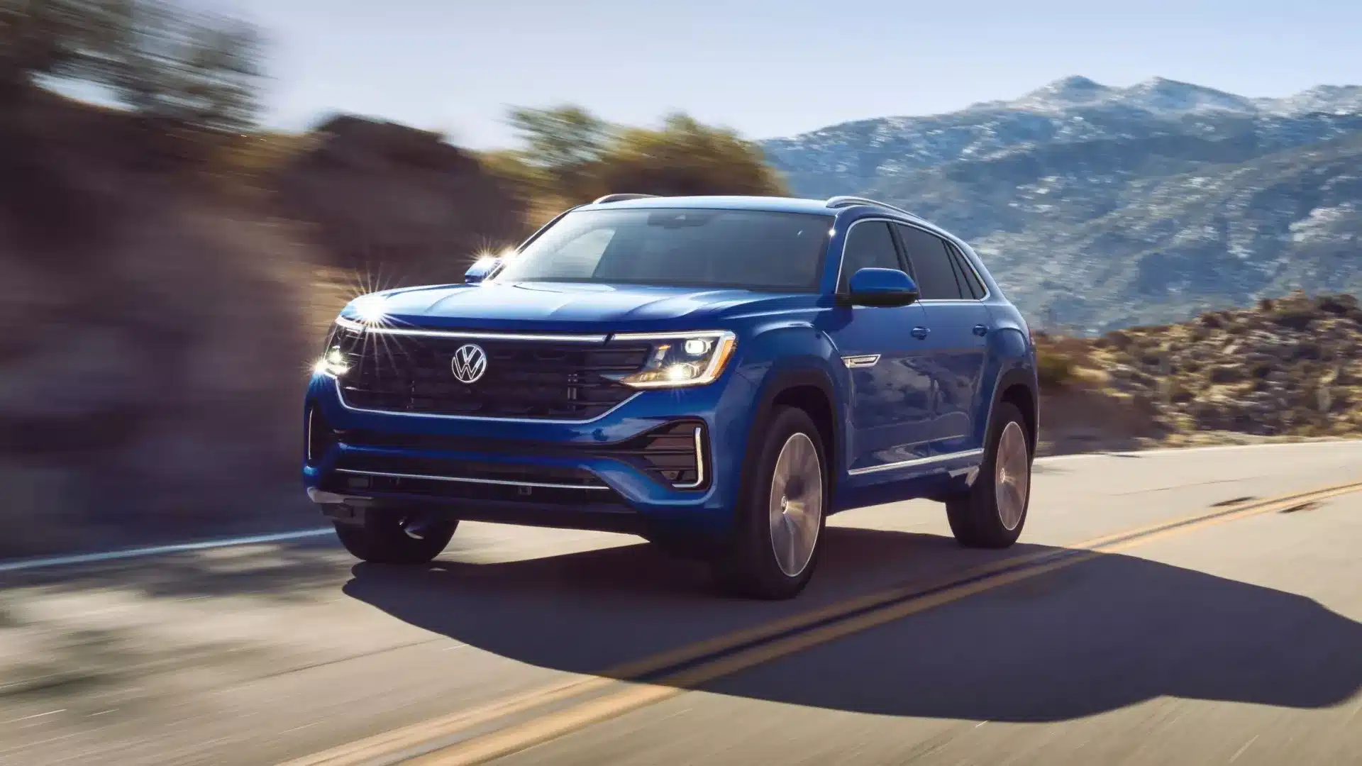 Volkswagen Atlas driving smoothly on a winding road.